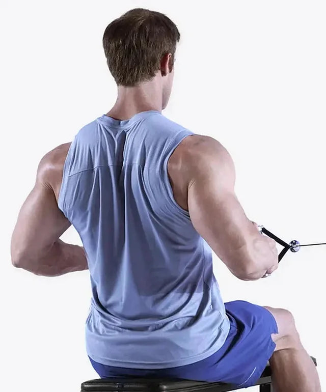 A man seen from behind doing a seated cable row